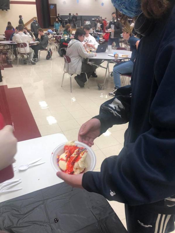 Student making their sundae Student making their sundae